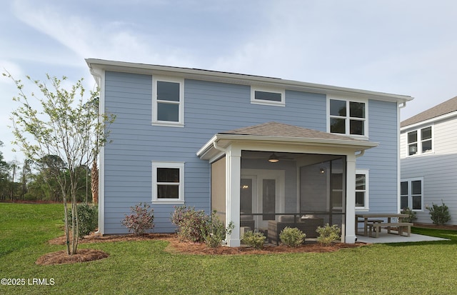 1122 Salty Hammock Ct, Beaufort, SC 29902 - rear view of house featuring a sunroom, a lawn, a ceiling fan, and roof with shingles