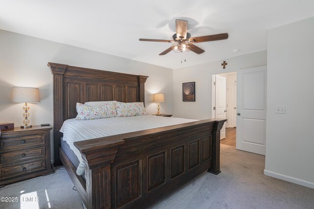 156 Teal Bluff Blvd, Seabrook, SC 29940 - bedroom with light colored carpet, baseboards, and a ceiling fan