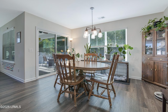 156 Teal Bluff Blvd, Seabrook, SC 29940 - dining space with wood finished floors, healthy amount of natural light, a chandelier, and baseboards