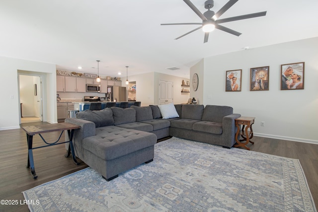 156 Teal Bluff Blvd, Seabrook, SC 29940 - living area featuring a ceiling fan, baseboards, and dark wood-style flooring