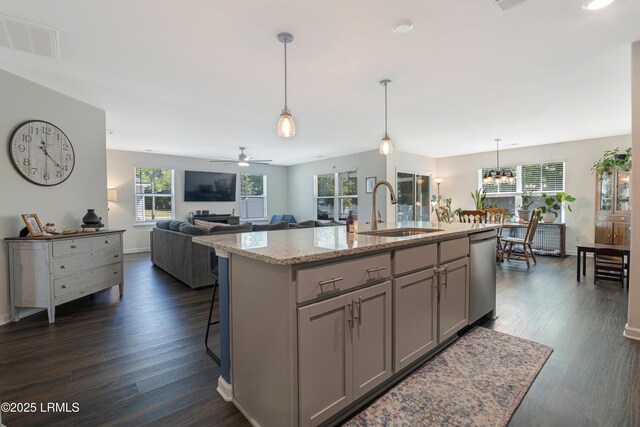 156 Teal Bluff Blvd, Seabrook, SC 29940 - kitchen featuring a sink, stainless steel dishwasher, gray cabinets, and plenty of natural light