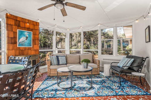 sunroom / solarium with ceiling fan