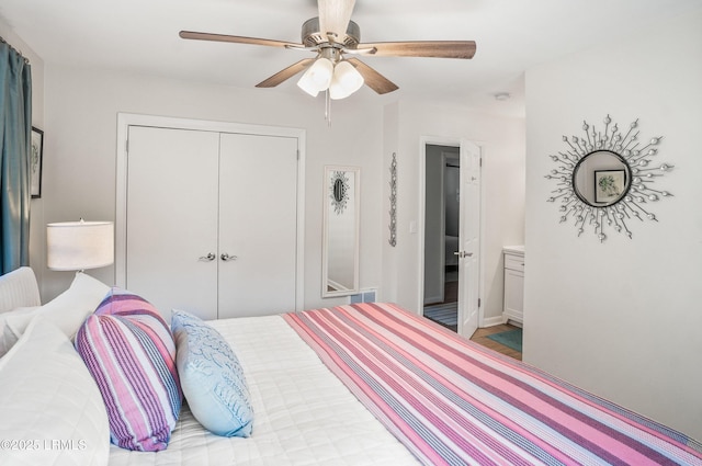 bedroom with ceiling fan and a closet