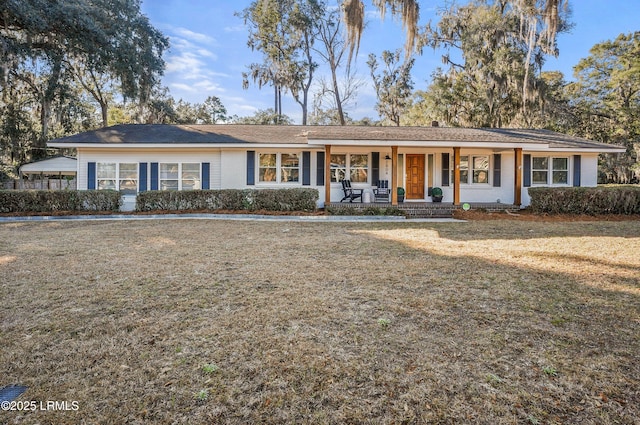 ranch-style home featuring a porch and a front yard