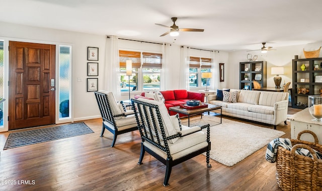 living room with hardwood / wood-style floors and ceiling fan