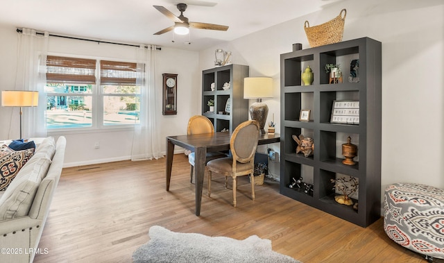 office featuring ceiling fan and light hardwood / wood-style flooring