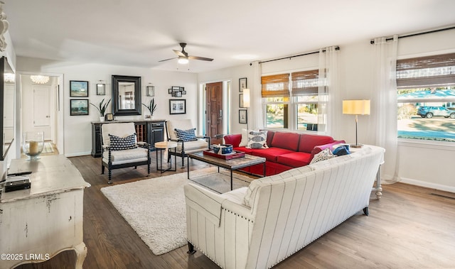 living room with hardwood / wood-style floors and ceiling fan