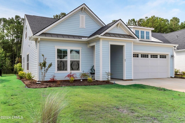 craftsman inspired home featuring a garage and a front yard