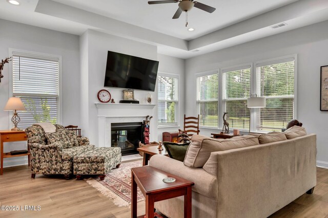 kitchen featuring white cabinetry, stainless steel appliances, and a center island with sink