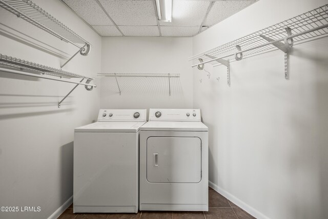 1203 Laudonniere St, Beaufort, SC 29902 - washroom with washing machine and dryer and dark tile patterned floors