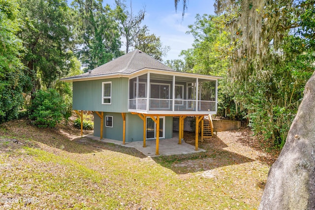 1203 Laudonniere St, Beaufort, SC 29902 - back of property with a sunroom and a patio area