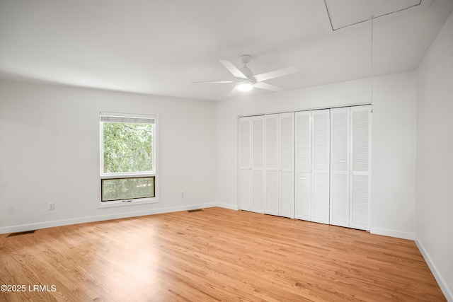 1203 Laudonniere St, Beaufort, SC 29902 - unfurnished bedroom featuring attic access, light wood finished floors, and ceiling fan