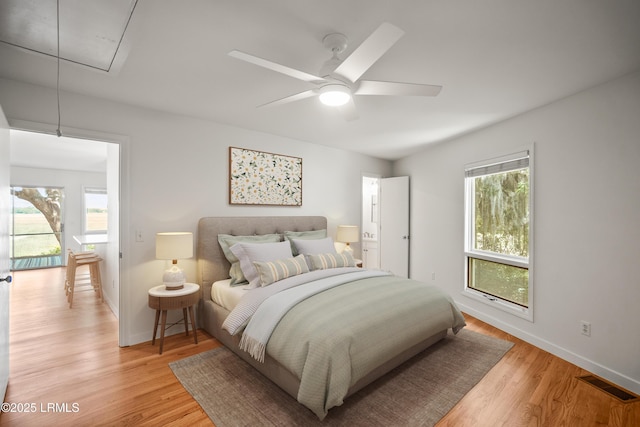 1203 Laudonniere St, Beaufort, SC 29902 - bedroom featuring attic access, light wood-type flooring, and multiple windows