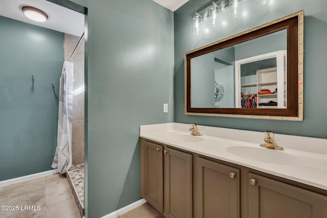 bathroom featuring tile patterned flooring, vanity, and a shower with shower curtain