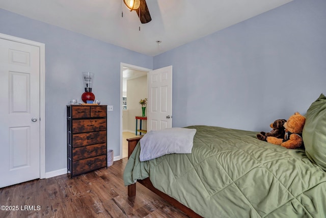 bedroom featuring dark hardwood / wood-style floors and ceiling fan