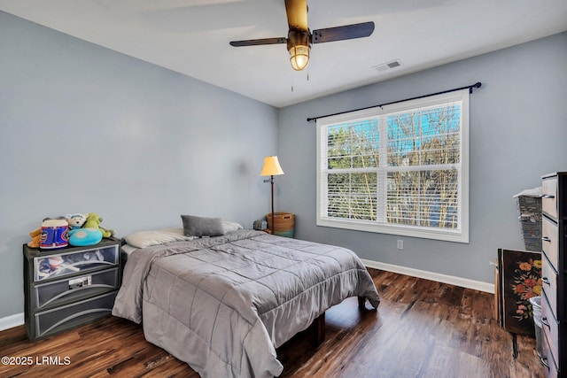 bedroom with dark hardwood / wood-style floors and ceiling fan