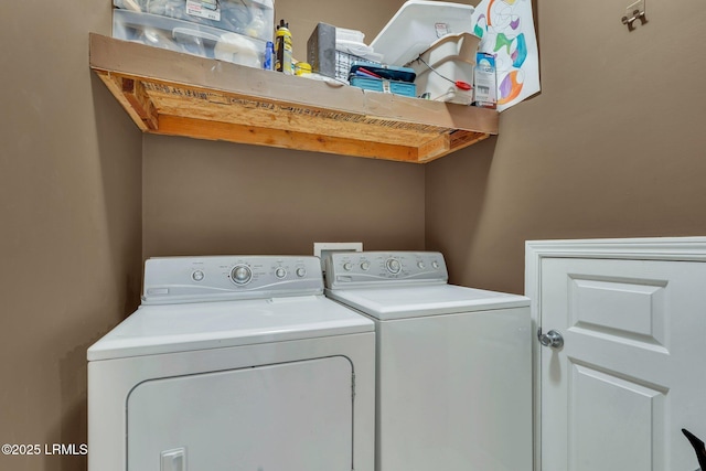 clothes washing area featuring washer and dryer