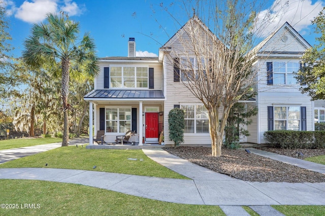 view of front facade with a porch and a front yard