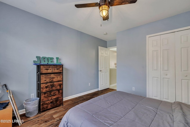 bedroom featuring hardwood / wood-style flooring, ceiling fan, and a closet