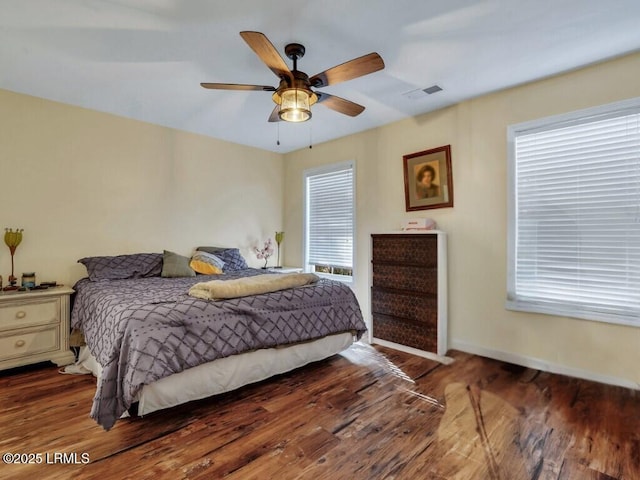 bedroom featuring dark wood-type flooring and ceiling fan