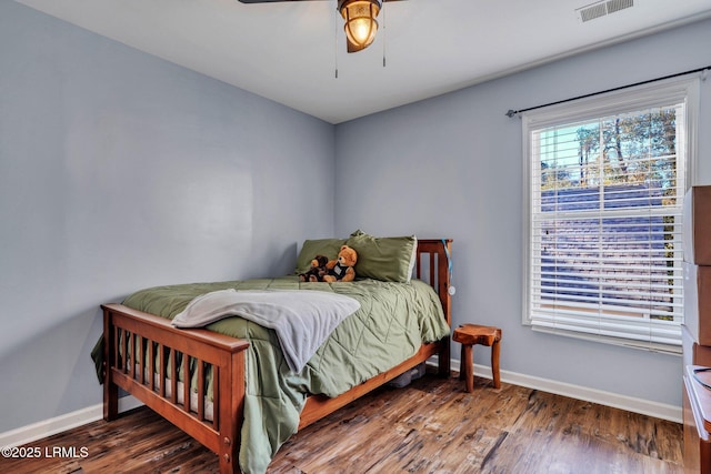 bedroom featuring dark wood-type flooring and ceiling fan