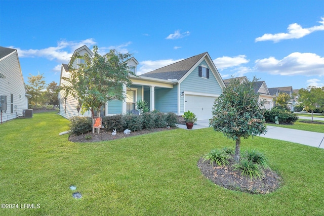 view of front of house featuring a garage, central air condition unit, and a front lawn