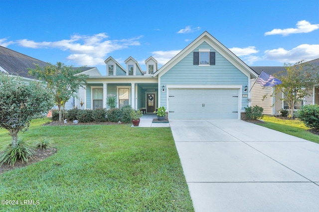 view of front of property featuring a garage and a front yard