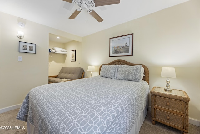 carpeted bedroom featuring ceiling fan and baseboards