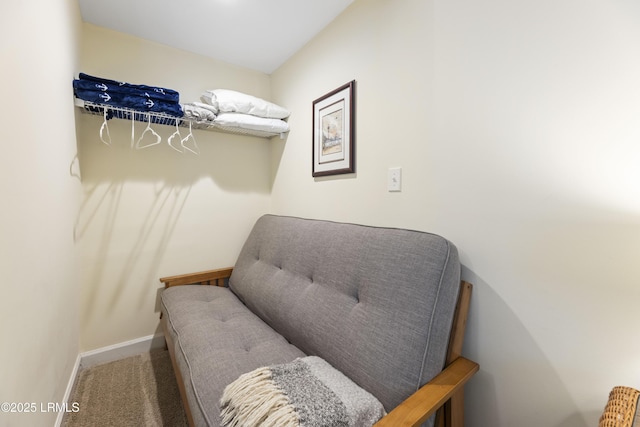 sitting room with carpet floors and baseboards