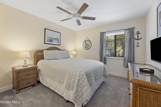 carpeted bedroom with ceiling fan and baseboards