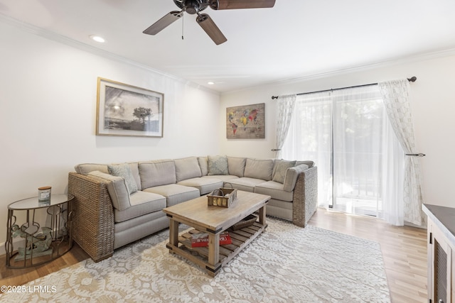 living room with ornamental molding, light wood-type flooring, ceiling fan, and recessed lighting