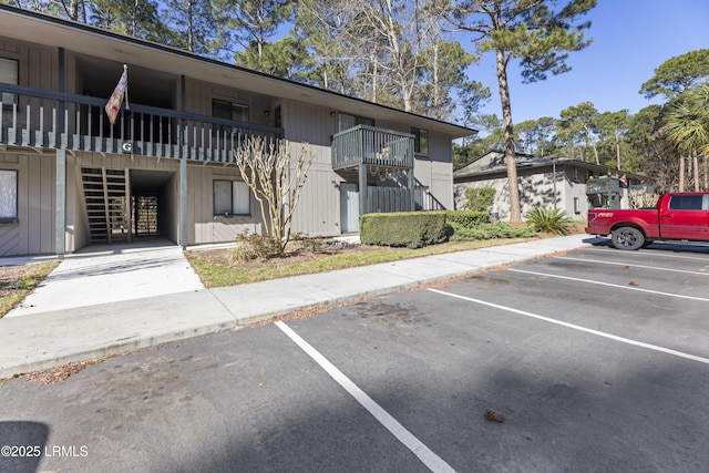 view of property featuring uncovered parking