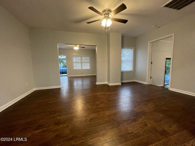 unfurnished room with dark hardwood / wood-style flooring and ceiling fan