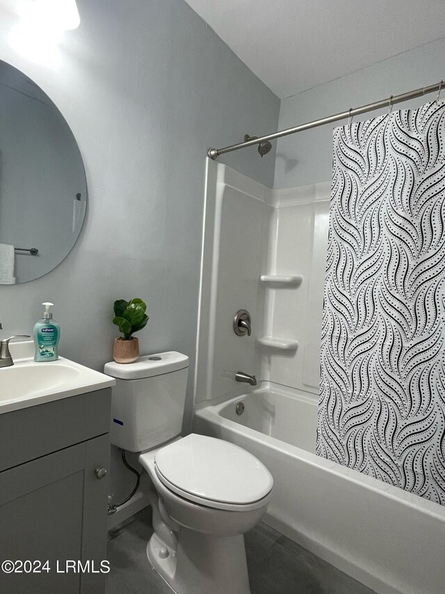 full bathroom featuring vanity, shower / bathtub combination with curtain, and toilet