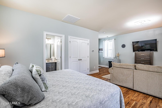 15 Carter Oaks Dr, Beaufort, SC 29907 - bedroom featuring ensuite bathroom, dark hardwood / wood-style flooring, and a closet
