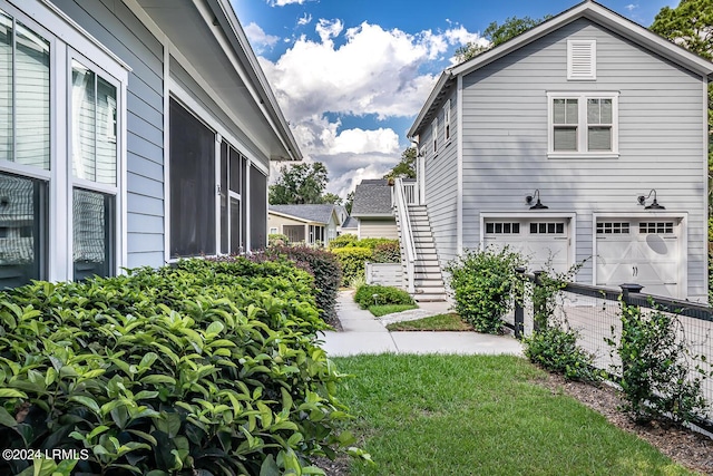 15 Carter Oaks Dr, Beaufort, SC 29907 - view of side of home with a yard and a garage
