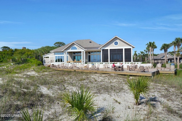 rear view of house with a sunroom