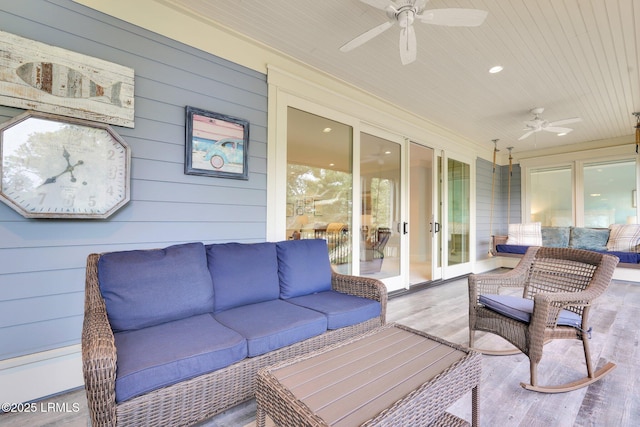 sunroom / solarium featuring wood ceiling and ceiling fan