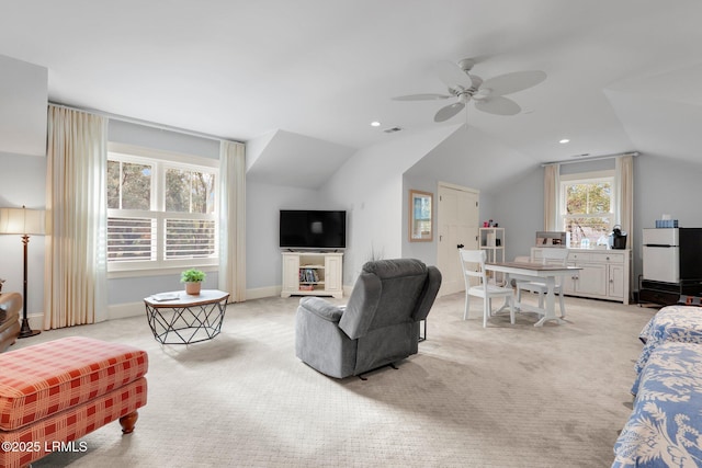 carpeted living room featuring lofted ceiling and ceiling fan