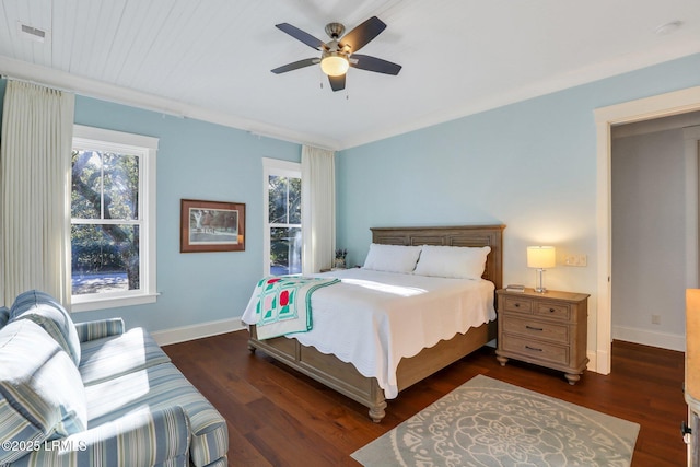 bedroom with dark hardwood / wood-style flooring, ornamental molding, and ceiling fan