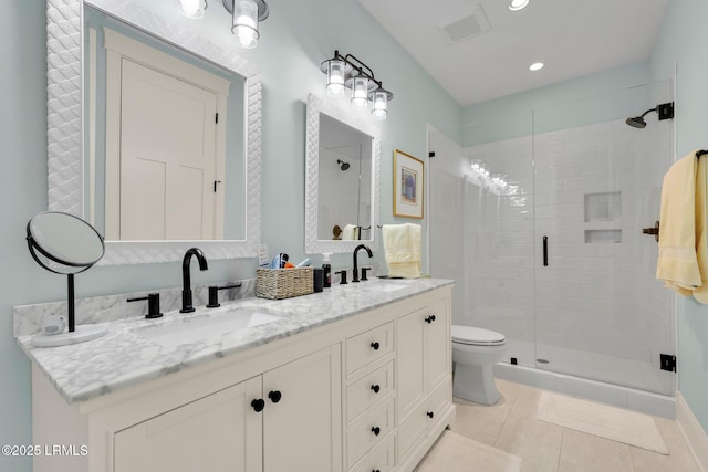 bathroom featuring walk in shower, tile patterned floors, vanity, and toilet