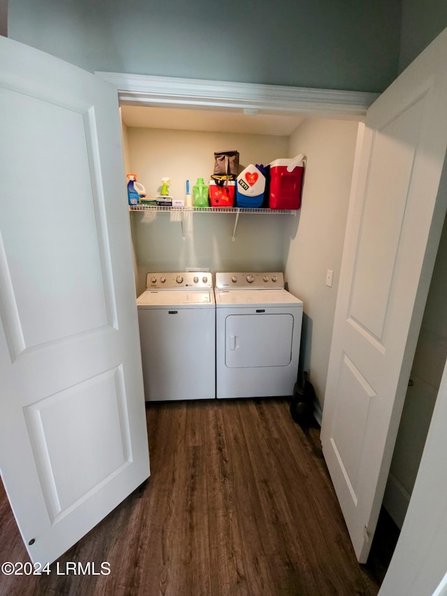 laundry room with dark hardwood / wood-style flooring and washer and clothes dryer