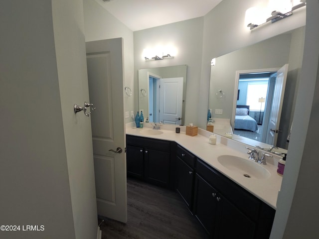 bathroom with vanity and hardwood / wood-style flooring