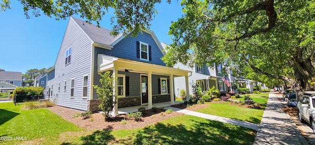 2708 Satilla Blvd, Beaufort, SC 29902 - view of front of house featuring ceiling fan, a front lawn, and stone siding
