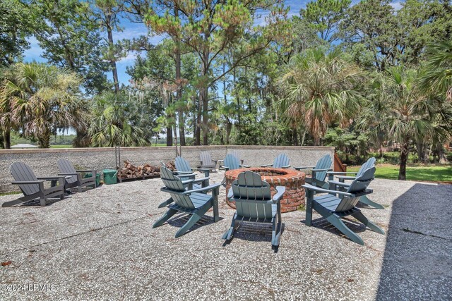 view of patio with a fire pit