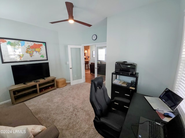 carpeted home office featuring ceiling fan and french doors