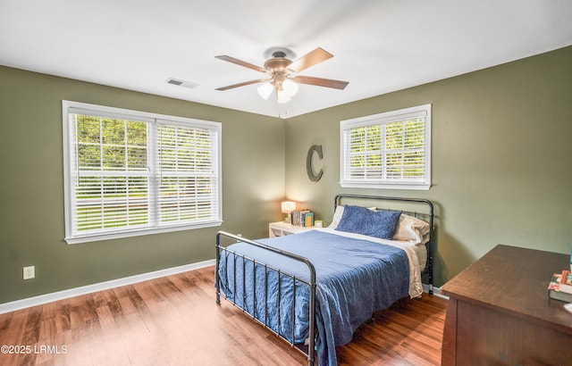 27 Tulifinny Ln, Yemassee, SC 29945 - bedroom featuring multiple windows, wood finished floors, and ceiling fan
