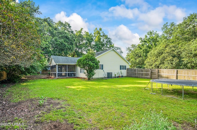 27 Tulifinny Ln, Yemassee, SC 29945 - fenced backyard with a sunroom and a trampoline
