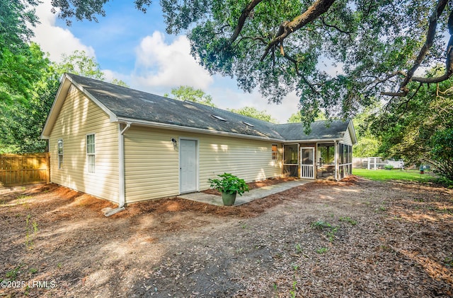 27 Tulifinny Ln, Yemassee, SC 29945 - back of property with a sunroom and a shingled roof