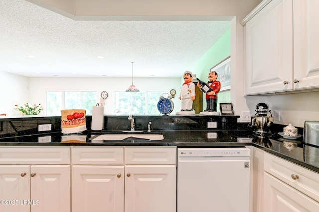 21 Raven Glass Ln, Bluffton, SC 29909 - kitchen with dishwasher, a sink, white cabinets, a textured ceiling, and dark stone countertops